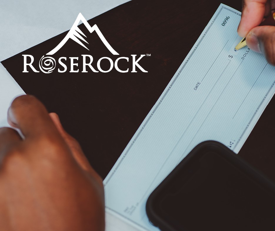 Close up view of financial check with RoseRock logo