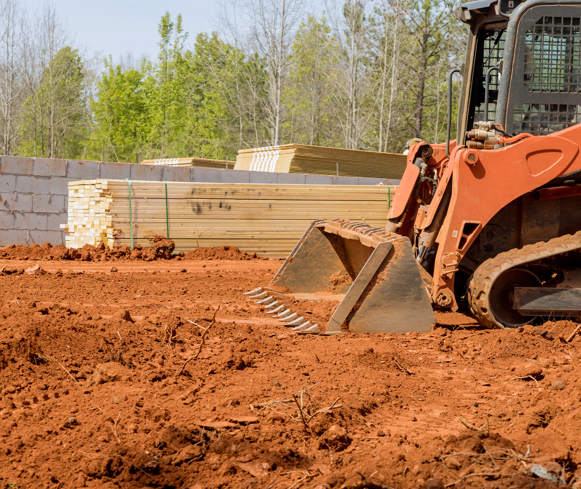 Excavator moving dirt