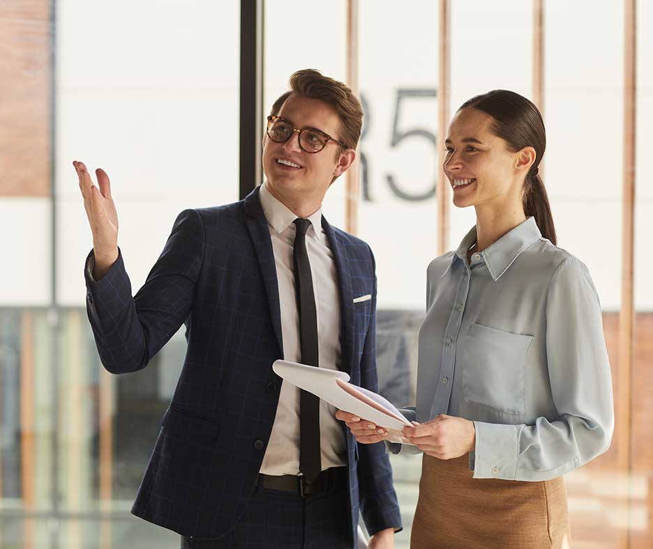 Two professionals looking at property