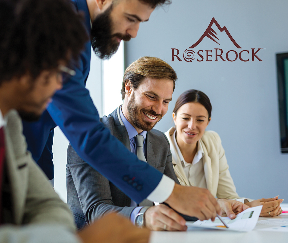 Private lending team in office with RoseRock logo